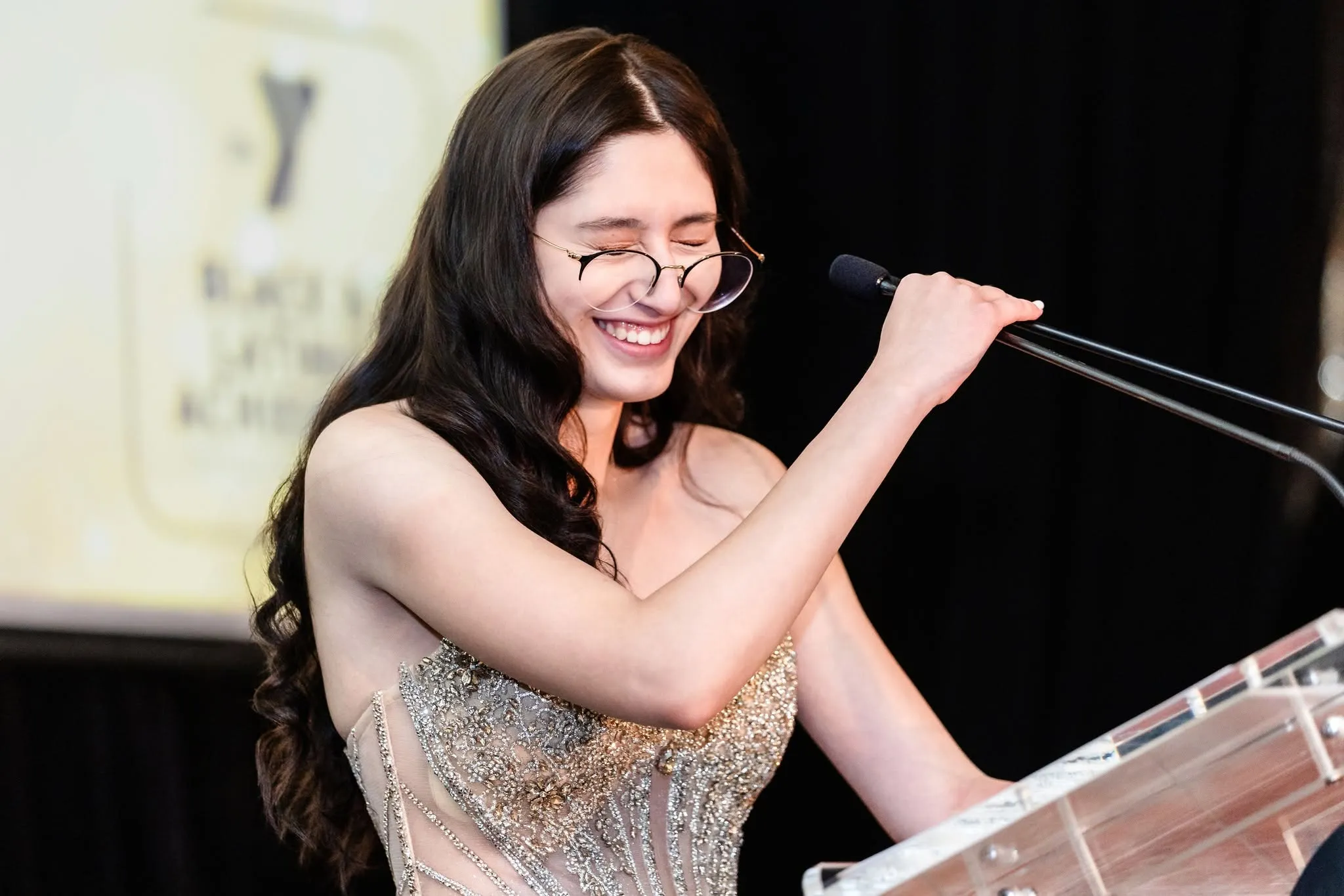 Girl at podium laughts