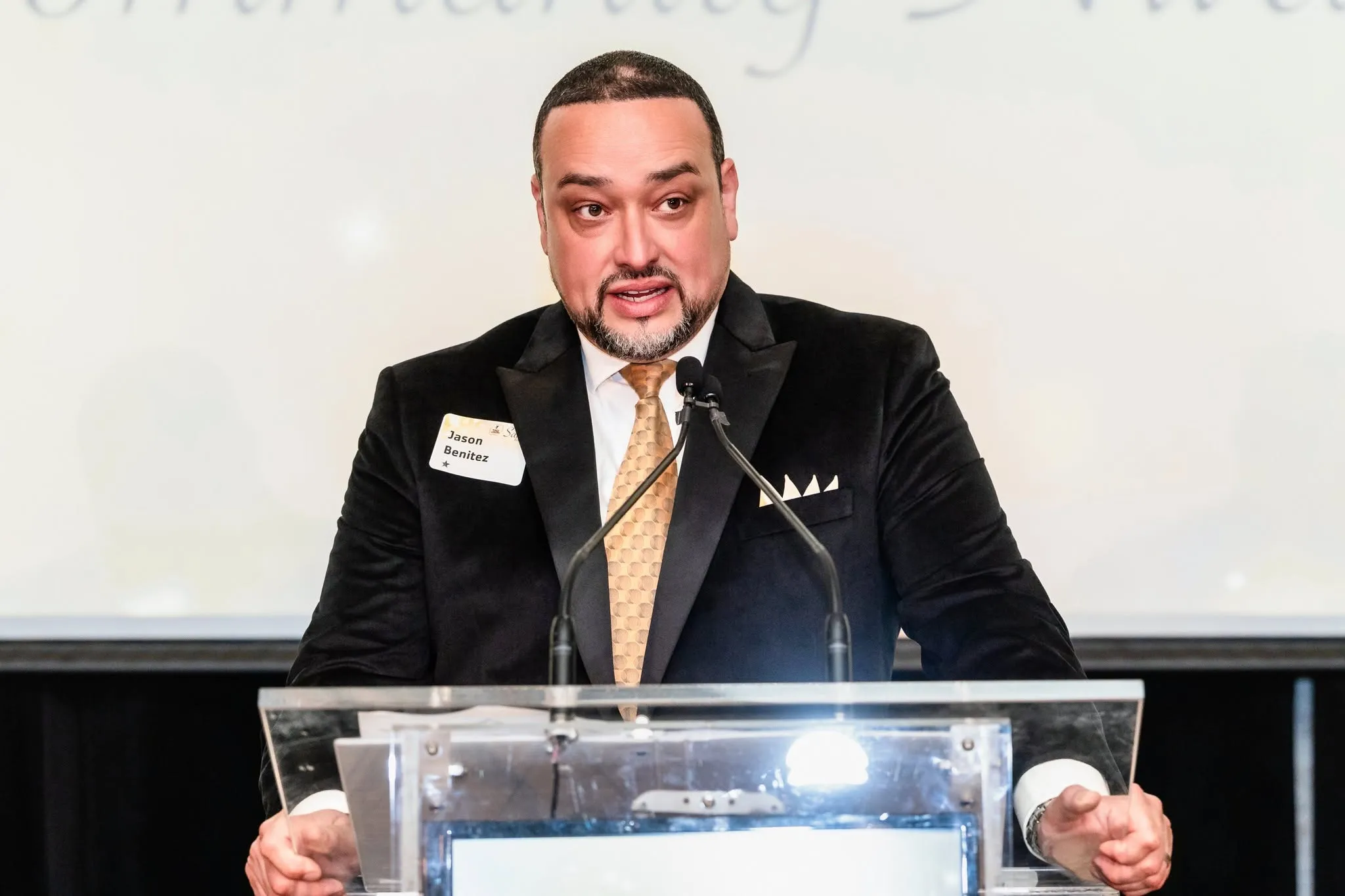 Man speaks at podium