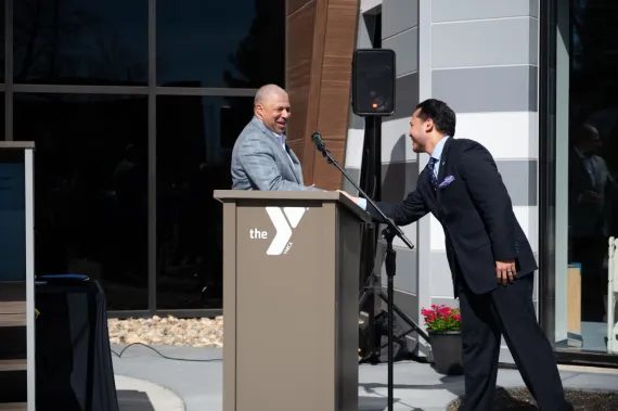 Shaking hands at podium