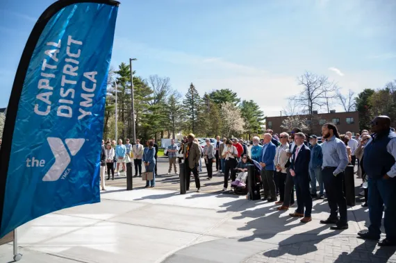 Crowd outside ribbon cutting
