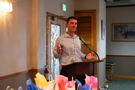Man speaks at podium