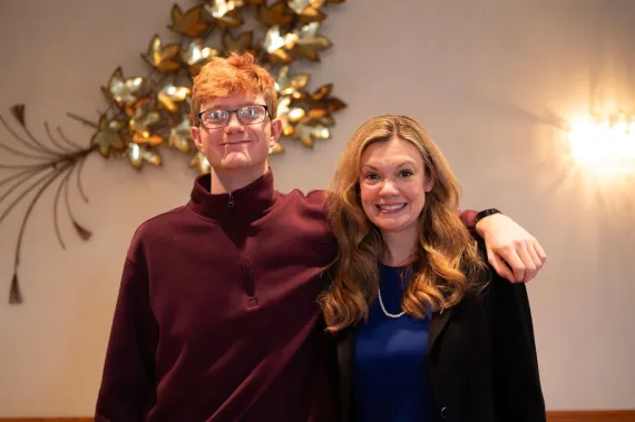 Group of two pose for a photo