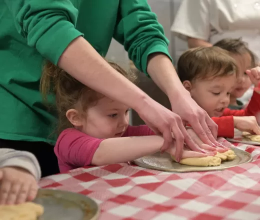 child making pizza