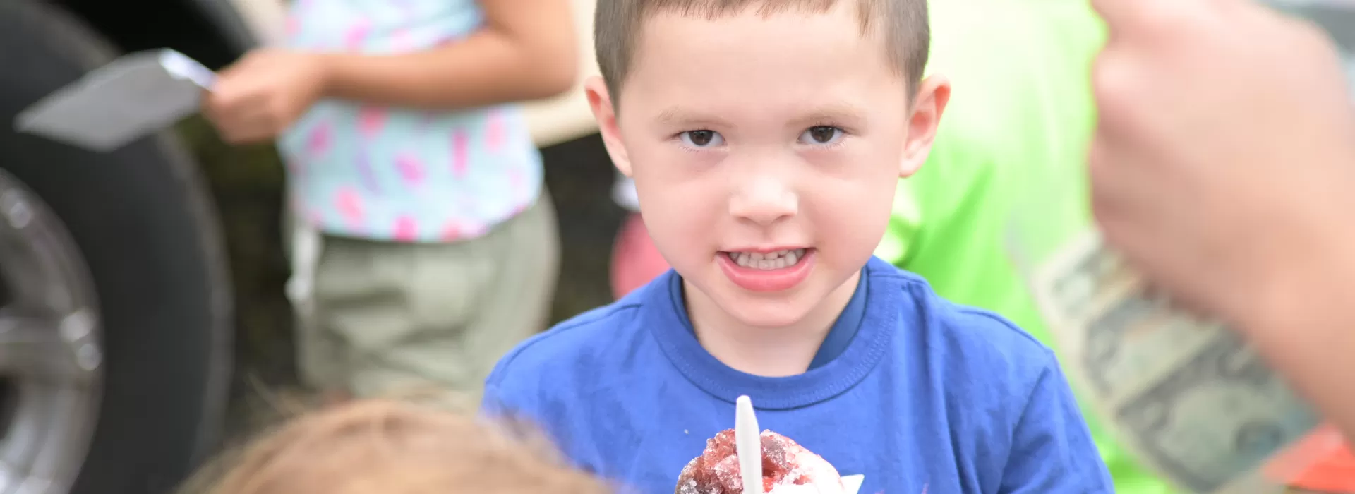 Kid eating an icee treat