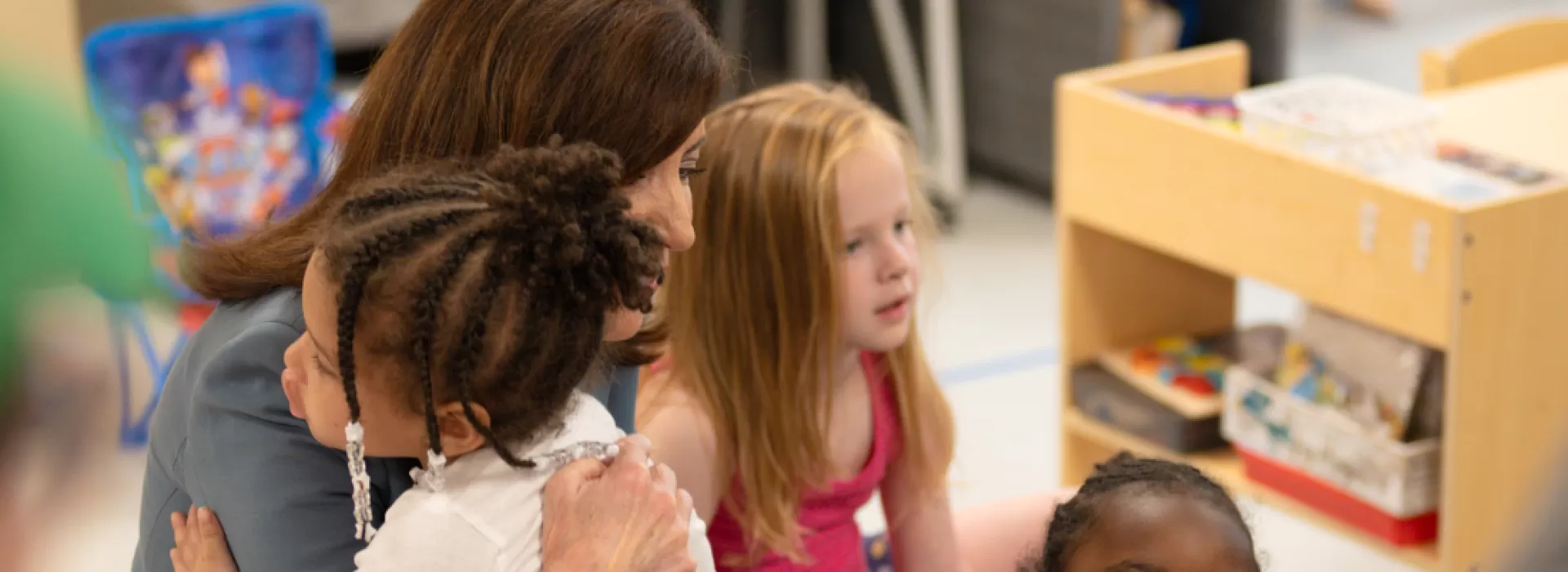 Governor Hochul hugging preschooler
